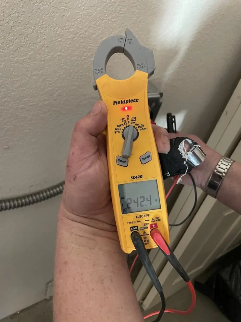 Voltage testing with clamp meter during Generator Installation in Huber Heights